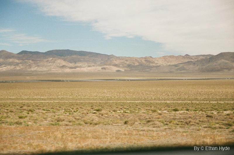 A wide desert basin with a solar plant on the far valley floor near Luning, Nevada, shot on film.